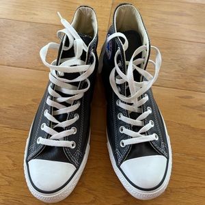 Never worn converse Chuck Taylor All stars Leather high tops. Size 9.5 women’s